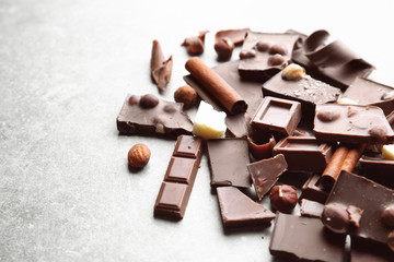 Heap of broken chocolate pieces on table