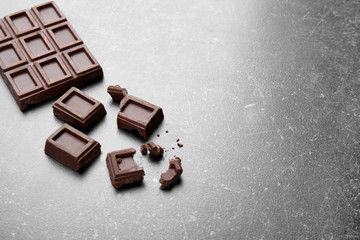 Broken chocolate pieces on table