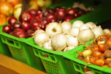 Baskets with vegetables in market