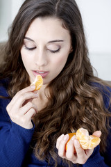 Woman eating fruit