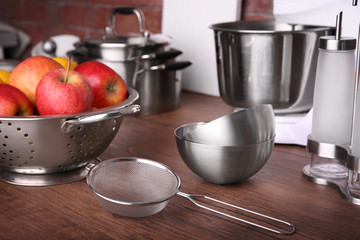 Kitchenware and fruits for cooking classes on wooden table