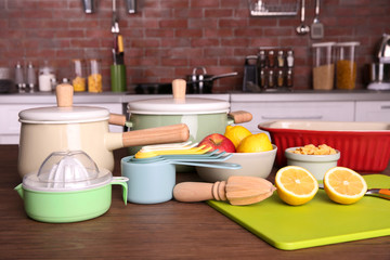 Kitchenware for cooking classes on wooden table