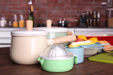 Kitchenware for cooking classes on wooden table