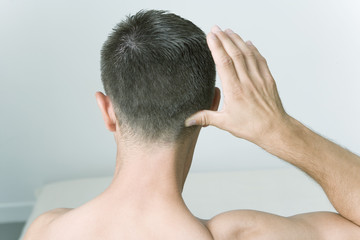 Fototapeta premium Model The Do In is an automassage technique of chinese origin, then imported in Japan This technique is based on the pressure of certains points (acupressure) aiming at correcting body disorders Pressure of a point at the base of the skull Aim : relieve torticolis