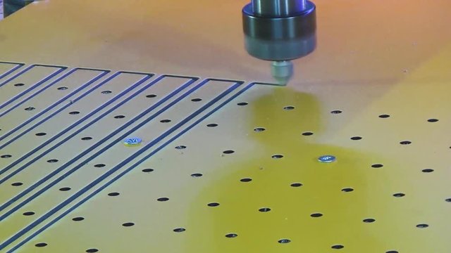 Milling cnc cuts the plastic panel hpl. Marking a rectangle with an automatic milling cutter.