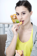 Woman eating fruit