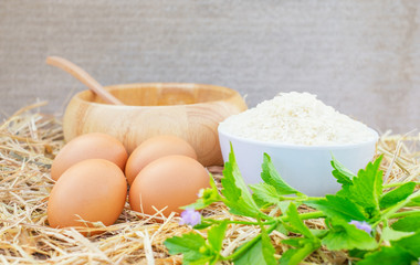 Good quality chicken eggs with a wooden bowl ,raw rice and vegetable. Fresh, suitable as a food ingredient, Copy space.