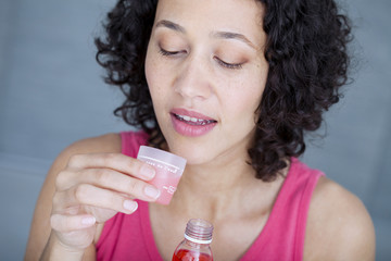 Woman having a mouthwash