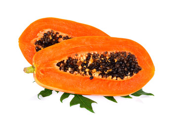 Half of sweet papaya fruit with leaf isolated on white background.