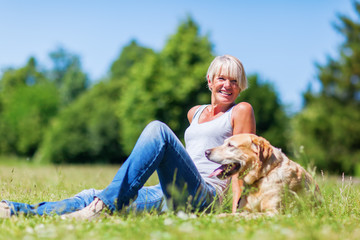 mature woman with a dog outdoor