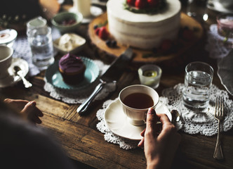 Friends Gathering Together on Tea Party Eating Cakes Enjoyment happiness