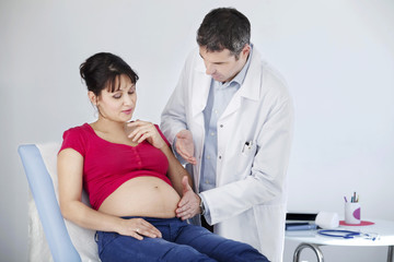 Fototapeta premium Abdomen palpation pregnant woman