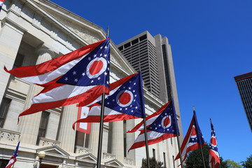 State of Ohio flags waving in front of the Statehouse in Columbus, OG. - obrazy, fototapety, plakaty
