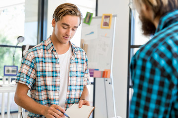 Fototapeta premium Two office workers at the desk