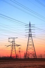 Fototapeta premium The silhouette of high voltage towers