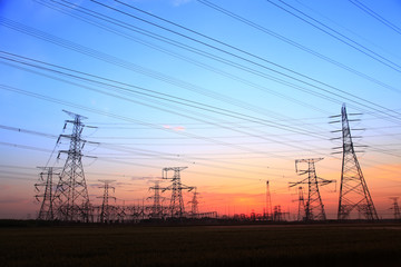The silhouette of high voltage towers