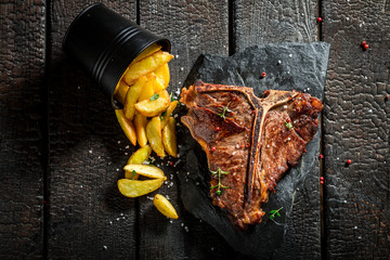 Closeup of chips and tbone steak with salt © shaiith