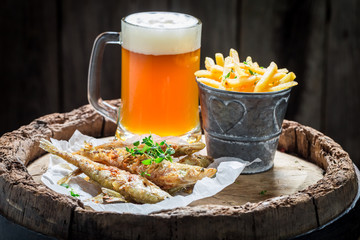 Homemade smelt fish with chips and cold beer