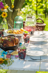 Dinner with chicken and potatoes served in sunny day