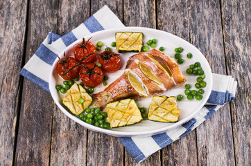 Baked fish with vegetables