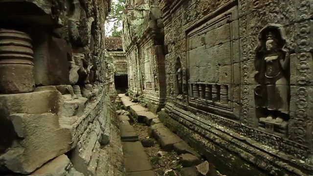 Preah Khan ancient temple in Angkor Wat area, smooth tracking first person shot through hallways