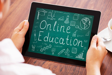 Person Holding Digital Tablet Showing Online Education