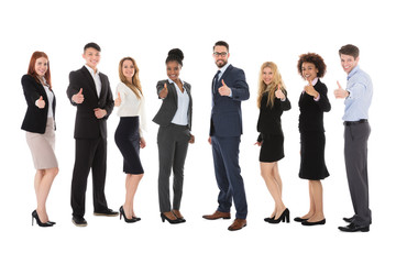 Group Of Multiracial Businesspeople Gesturing Thumbs Up