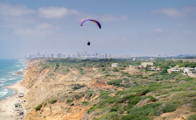 Paragliding over Mediterranean sea and Arsuf beach. Israel