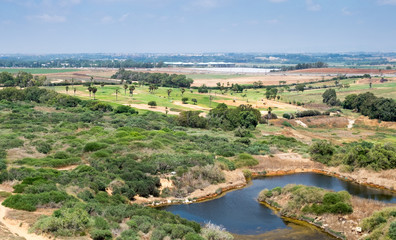 Fototapeta na wymiar Aerial view on golf course and pond at Arsuf. Israel