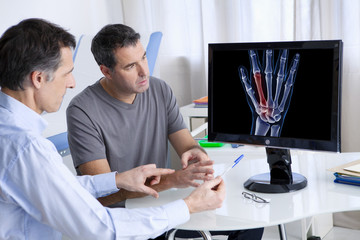 Male patient consulting for hand pain