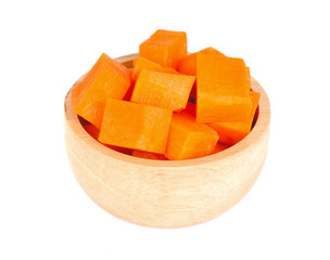Carrot slices in a wooden bowl on a white background