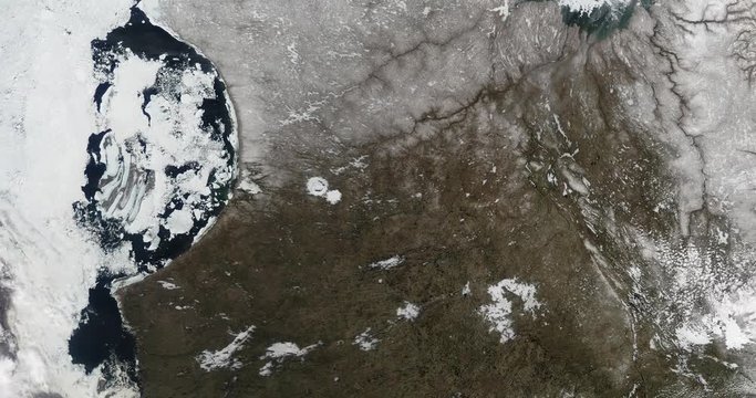 High-altitude overflight aerial of sea ice in Canada's Hudson Bay. Clip loops and is reversible. Elements of this image furnished by USGS/NASA Landsat