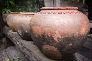Fototapeta na wymiar Ancient Thai Jars for storage rainwater