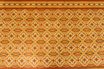 Colonial house architecture Vintage floor tiles with orange, green, red as a decorative design...