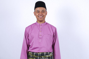 Man in traditional clothing, standing  celebrate Eid Fitr.