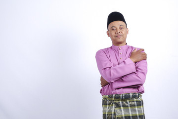 Man in traditional clothing, standing  celebrate Eid Fitr.