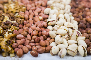 Nuts on a  wooden table.
