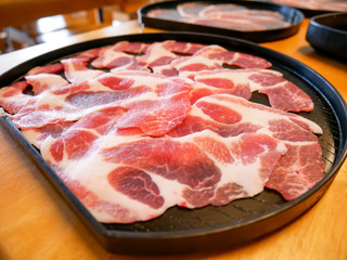 close up of slide pork on black plate