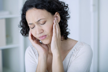 Woman suffering from earache