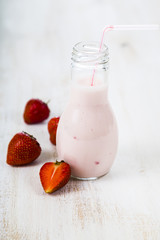 Smoothies and ripe strawberry