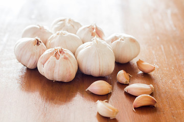 Garlic on wooden background.