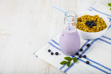 Smoothies,muesli and ripe blueberries