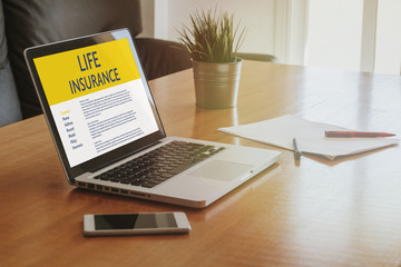 Life Insurance concept: Laptop computer with Life Insurance contract in the screen.