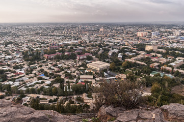 View of the city of Osh in Kyrgyzstan from a height of mountain Suleiman