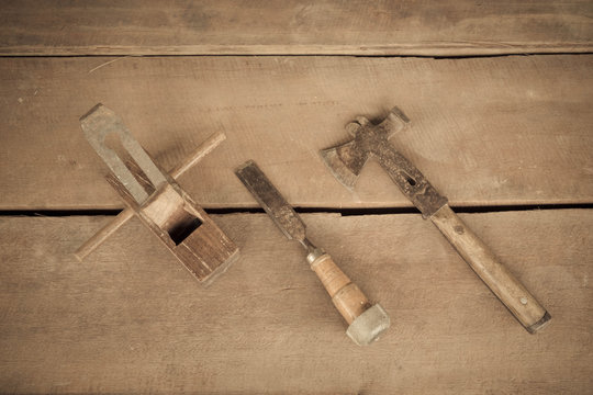wood carpenter tools chisel and hammer in vintage style