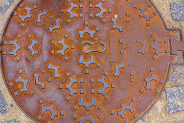 Decorated and rusty culvert lid