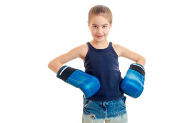 portrait of little girl in blue boxing gloves