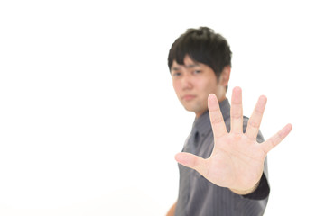 ストップのジェスチャーをする男性