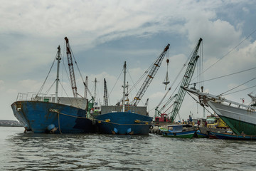 Sunda Kelapa old Harbour with fishing boats, ship and docks in Jakarta, Indonesia