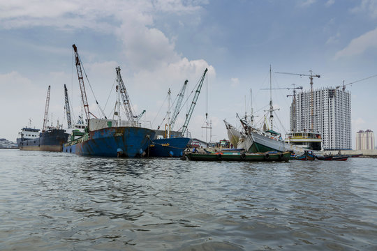 Sunda Kelapa old Harbour with fishing boats, ship and docks in Jakarta, Indonesia